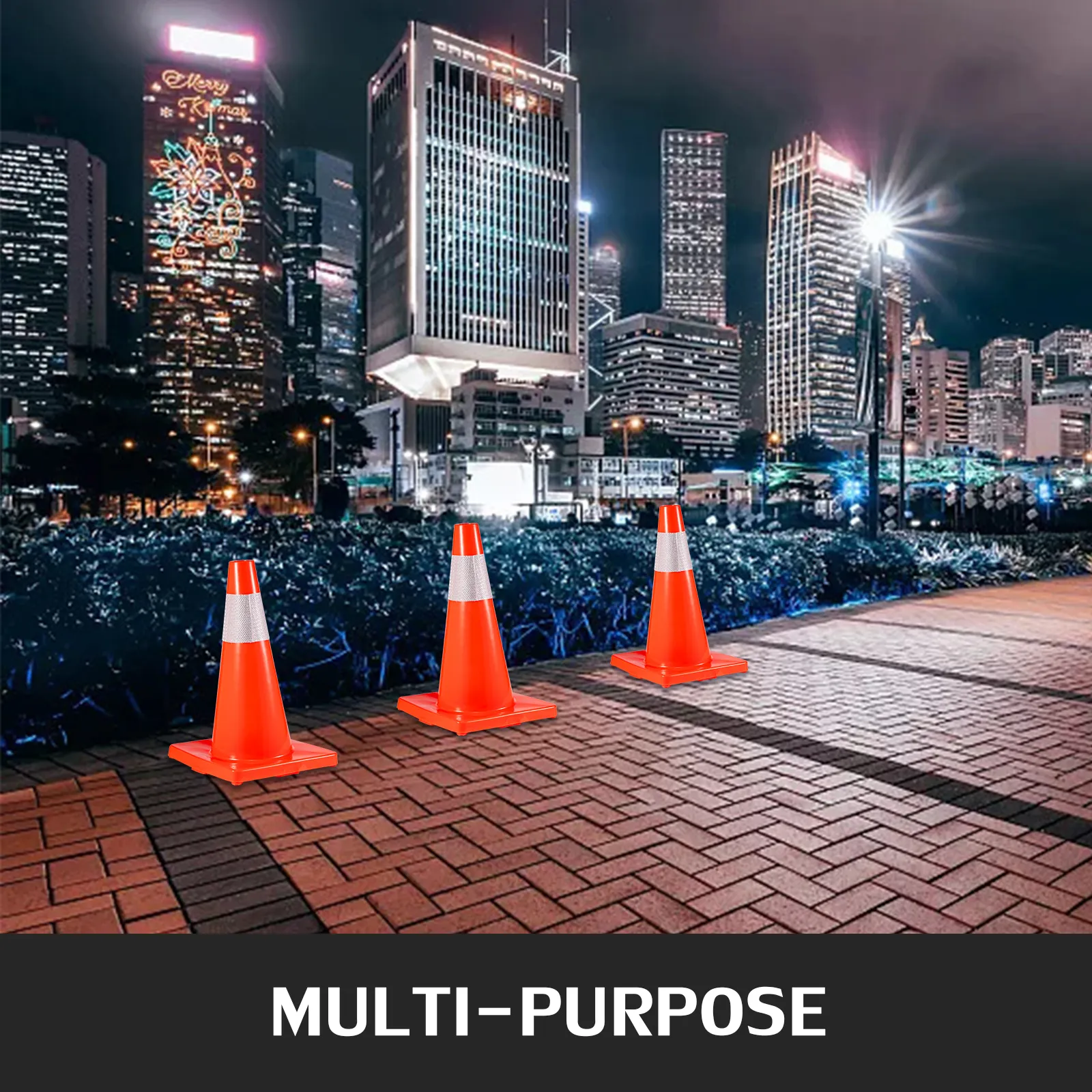 VEVOR traffic cones on city sidewalk at night with illuminated skyscrapers.