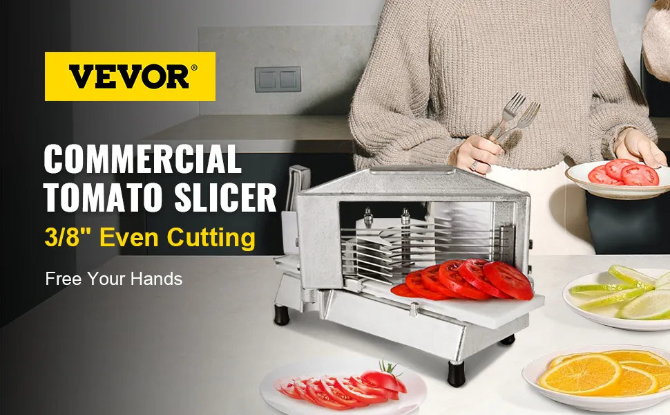 Affettatrice per pomodori VEVOR sul bancone, per affettare i pomodori, con frutta e utensili nelle vicinanze.