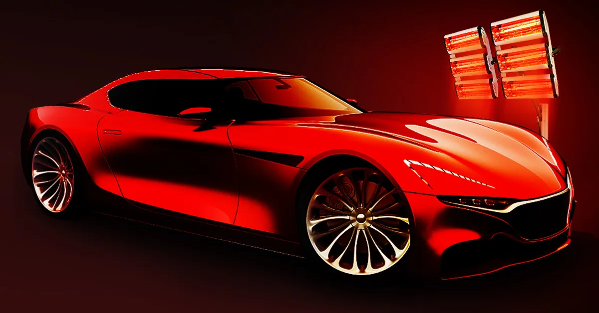 Coche deportivo rojo iluminado por la lámpara de curado de pintura VEVOR, resaltando su diseño elegante.