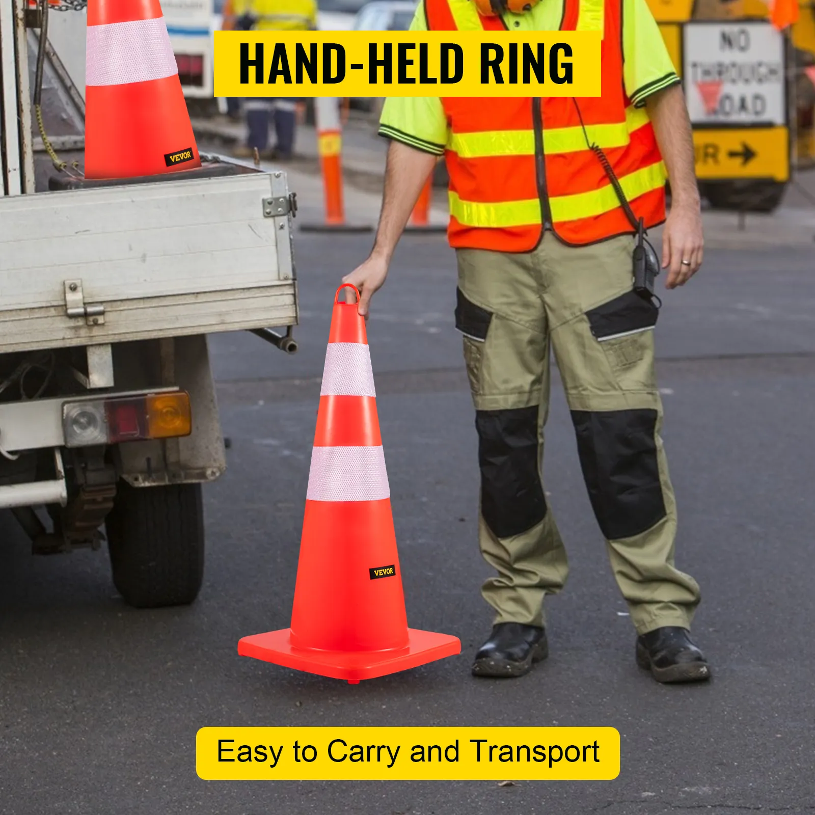 Arbeiter hält einen VEVOR-Verkehrskegel mit Handring in der Nähe einer Baustelle.