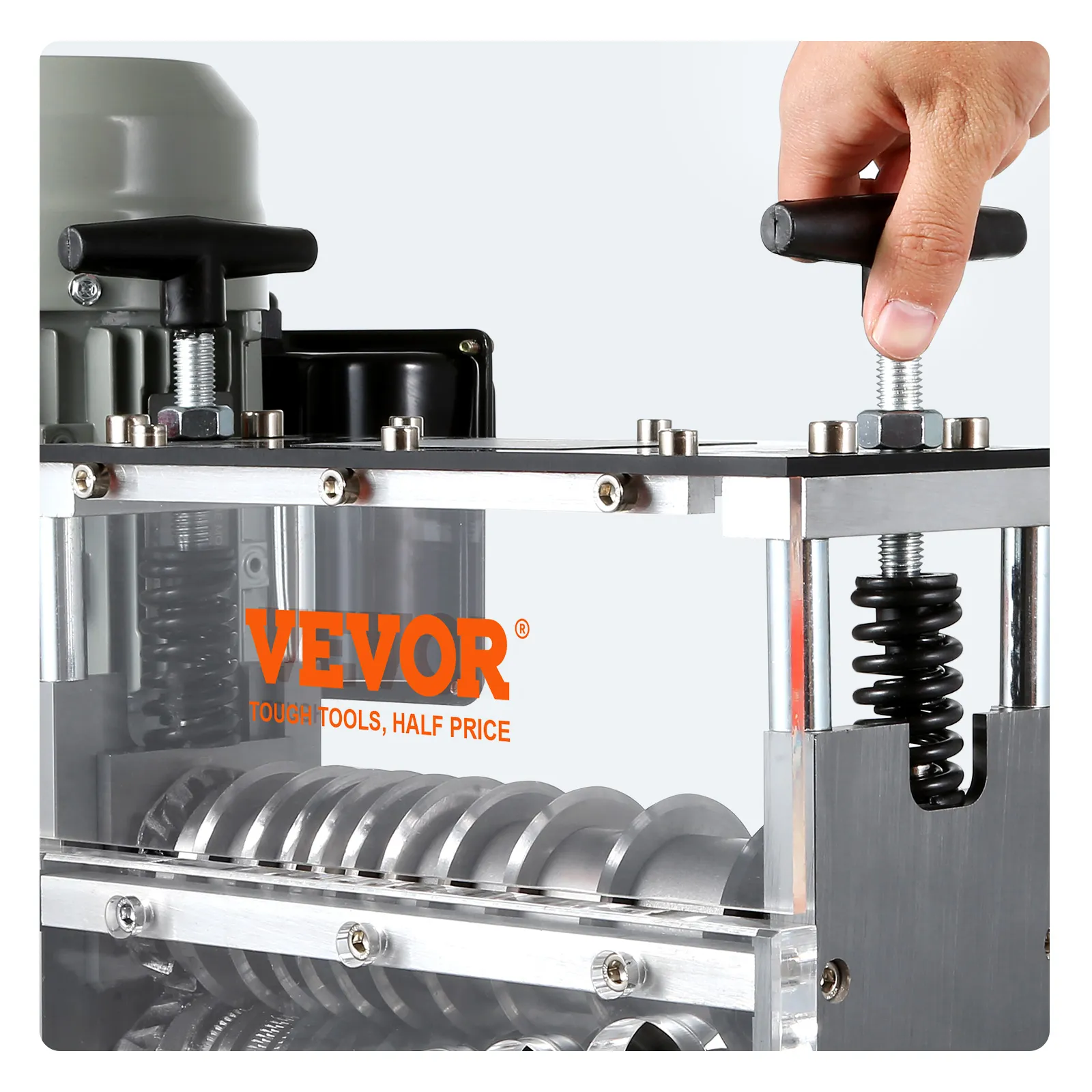 hand operating the VEVOR wire stripping machine with visible gears and screws.