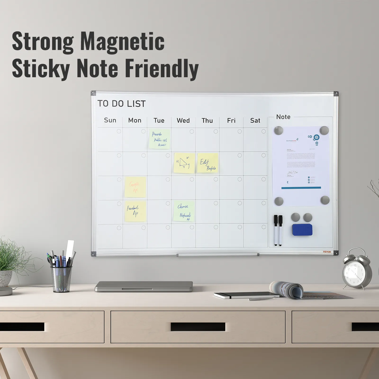 VEVOR calendar whiteboard on office desk with sticky notes, markers, eraser, and laptop. text: "strong magnetic sticky note friendly."
