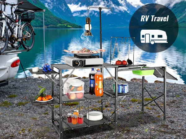 VEVOR camping kitchen table set up by a scenic lake with an rv and bicycles in the background for rv travel.