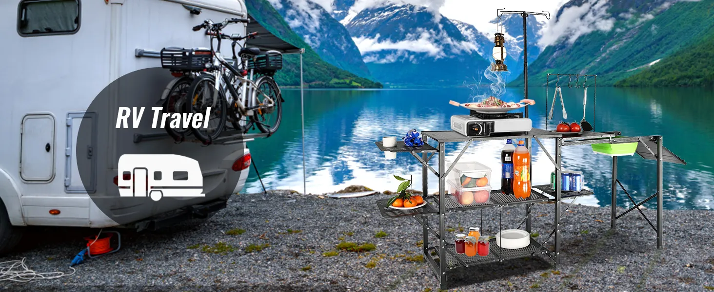 VEVOR camping kitchen table set up by a scenic lake with an rv and bicycles in the background for rv travel.