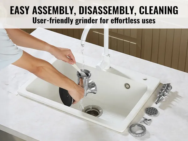 cleaning and assembling parts of the VEVOR manual meat grinder in a kitchen sink.