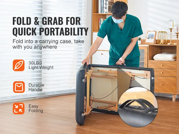 VEVOR portable massage table being folded for easy carrying with durable handle and lightweight design.