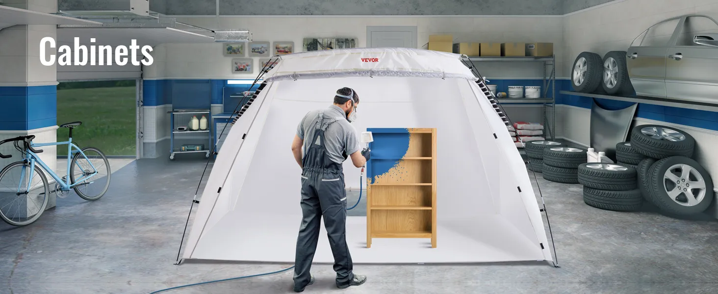 VEVOR portable paint booth in garage, showing person spray painting a wooden shelf unit blue.
