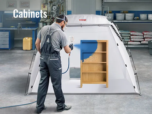 Mobile Lackierkabine von VEVOR in einer Garage mit einem Mann, der einen Holzschrank lackiert.