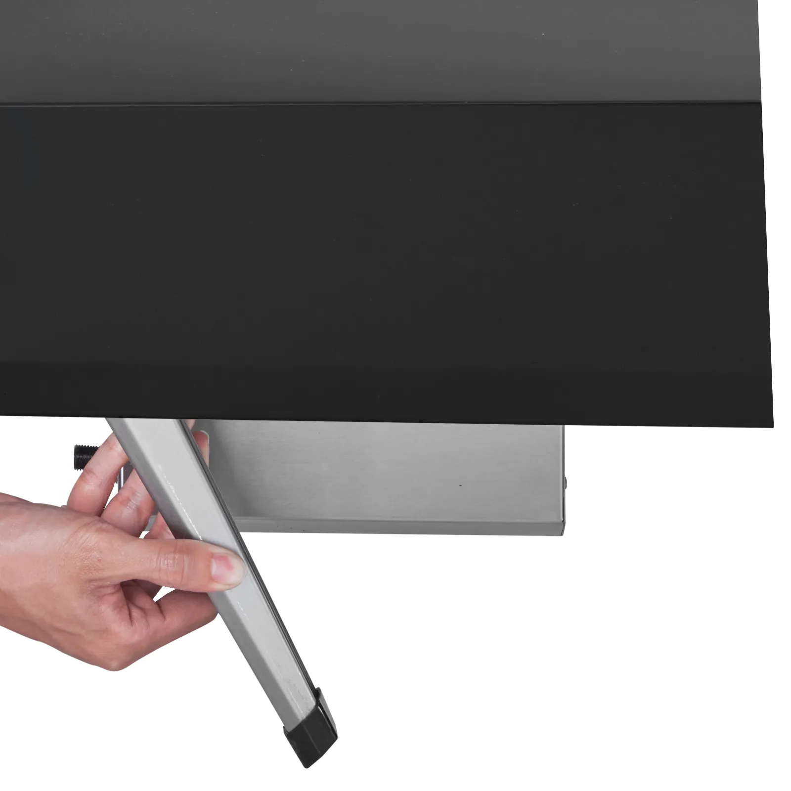 hand adjusting the silver leg of a black VEVOR outdoor pizza oven.