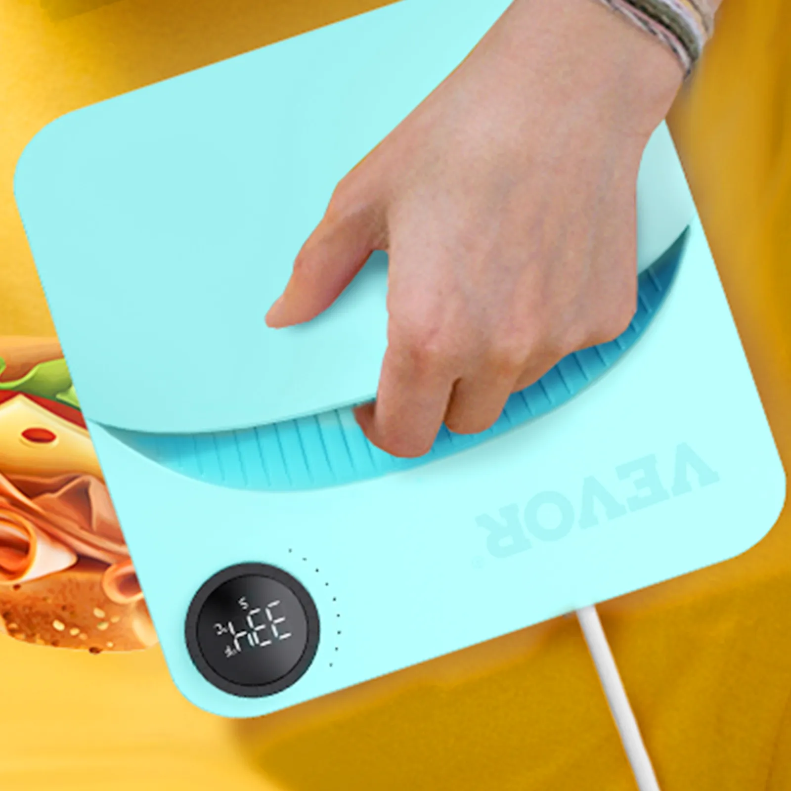 hand pressing the VEVOR heat press machine on a yellow fabric with a digital temperature display.