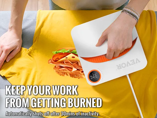 VEVOR heat press machine pressing a yellow shirt with hamburger design, emphasizing safety feature.