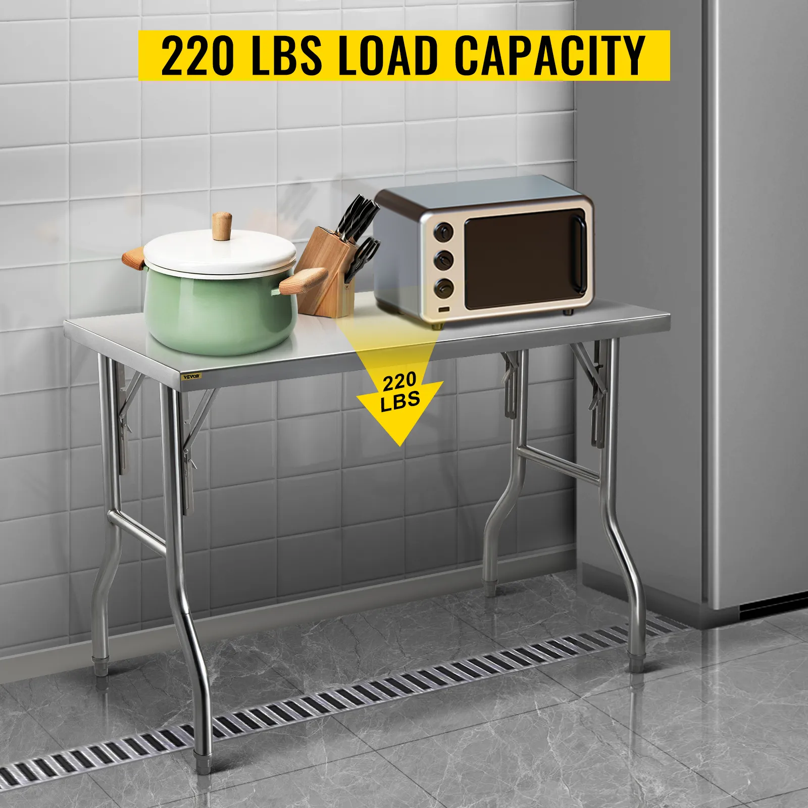 VEVOR stainless steel kitchen island with a 220 lbs load capacity, holding a pot and toaster.