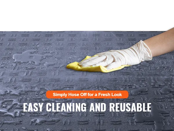 spraying water on VEVOR garage tiles for easy cleaning and reusable functionality.