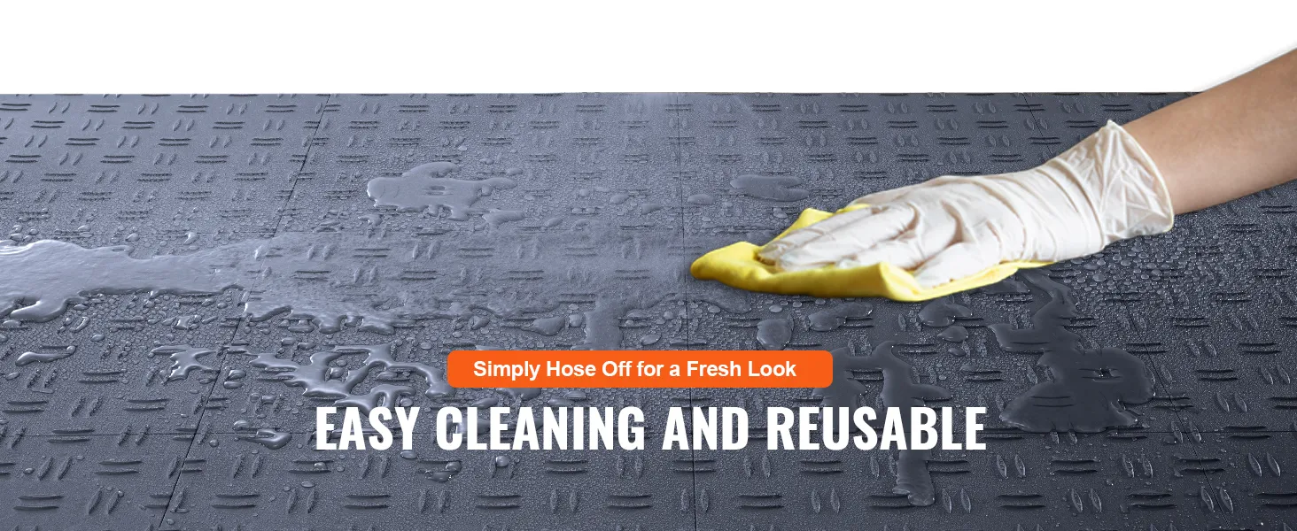 spraying water on VEVOR garage tiles for easy cleaning and reusable functionality.
