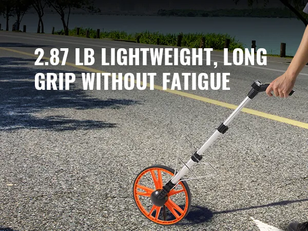 person using a VEVOR measuring wheel on a tree-lined road, highlighting lightweight and long grip.