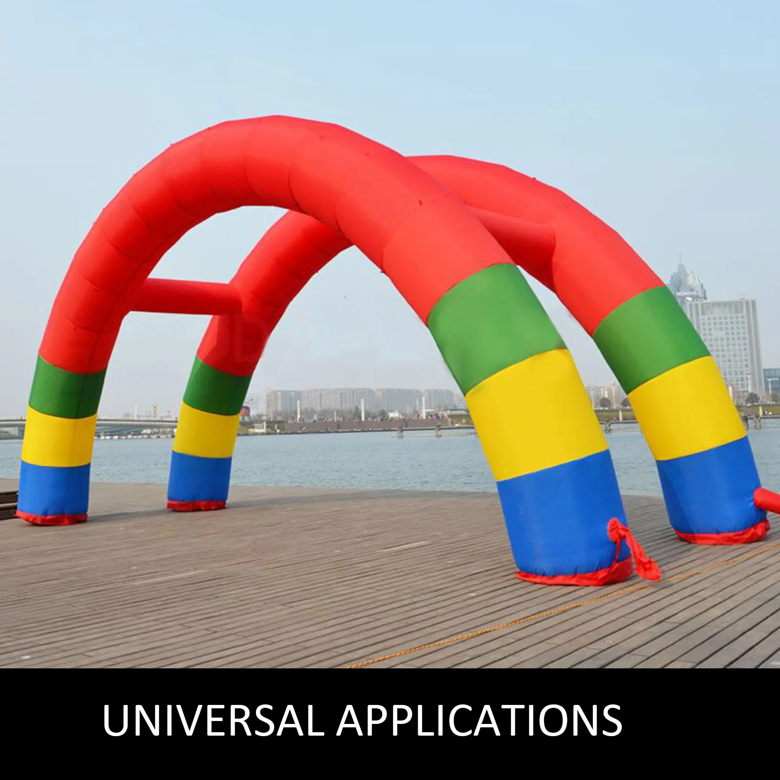 VEVOR inflatable rainbow arch with cityscape background on a wooden deck.