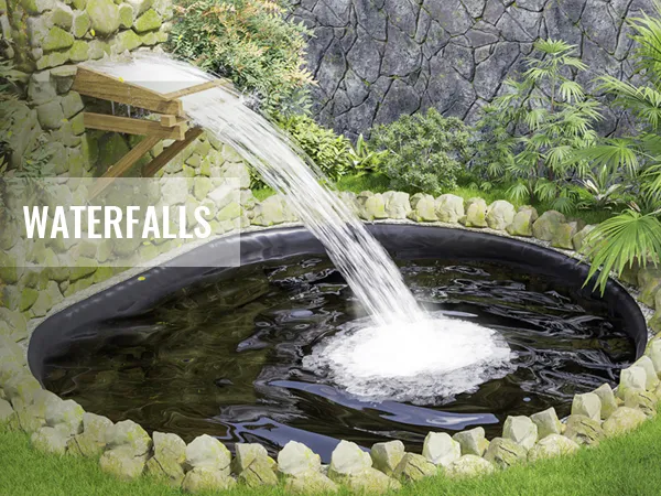 waterfall pouring into a round pond surrounded by rocks and lush greenery using VEVOR pond liner.