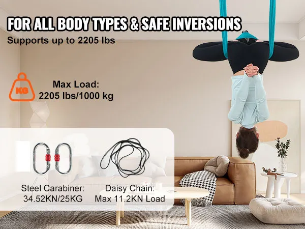 woman using VEVOR aerial yoga hammock in living room, supporting up to 2205 lbs for safe inversions.