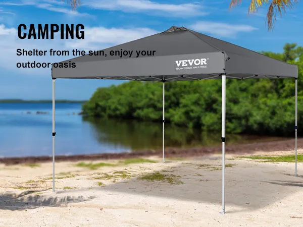 VEVOR pop-up canopy tent on a beach surrounded by palm trees, providing sun shelter for camping.