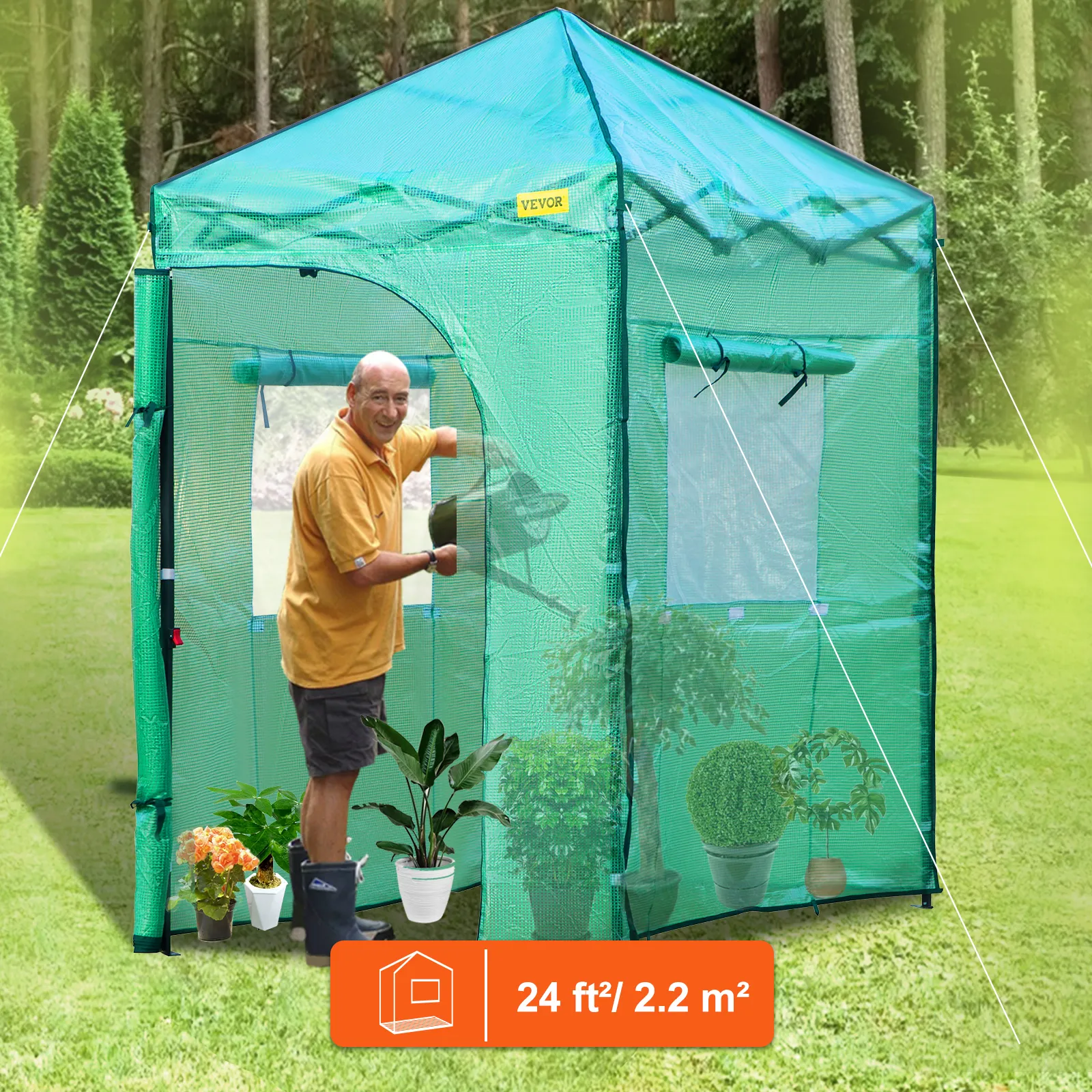 VEVOR-kas met planten en een persoon die aan het tuinieren is, grootte 24 ft² / 2,2 m² in een weelderige tuin.