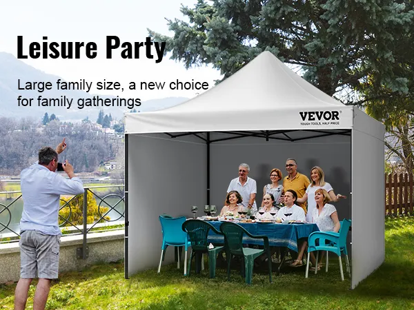 outdoor family gathering under a VEVOR pop up canopy with scenic background and photographer capturing moments.
