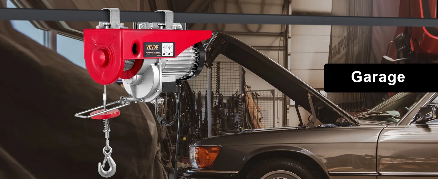 VEVOR 2200 lbs wireless attic lift installed in a garage with a car in the background.