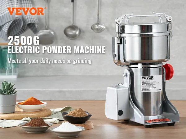 VEVOR electric grain mill with bowls of colorful powders, utensils, and plants on a kitchen countertop.