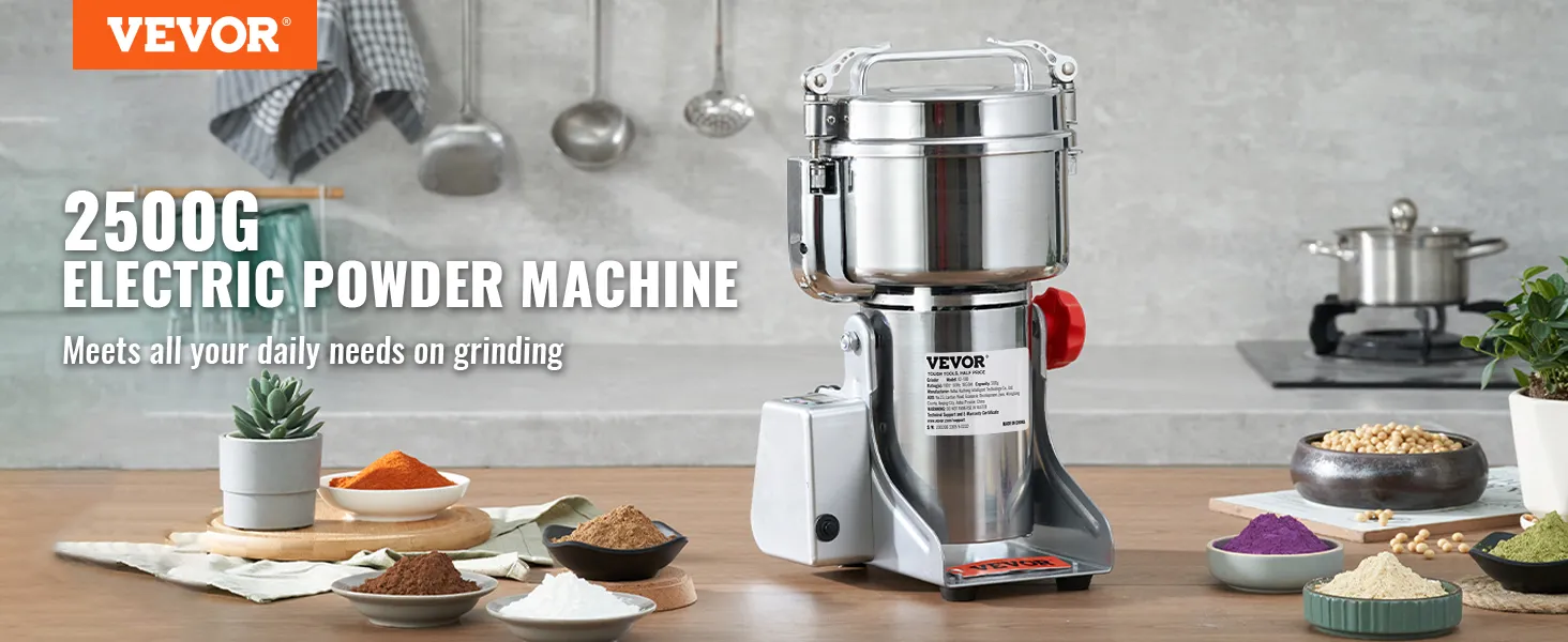 VEVOR electric grain mill with bowls of colorful powders, utensils, and plants on a kitchen countertop.