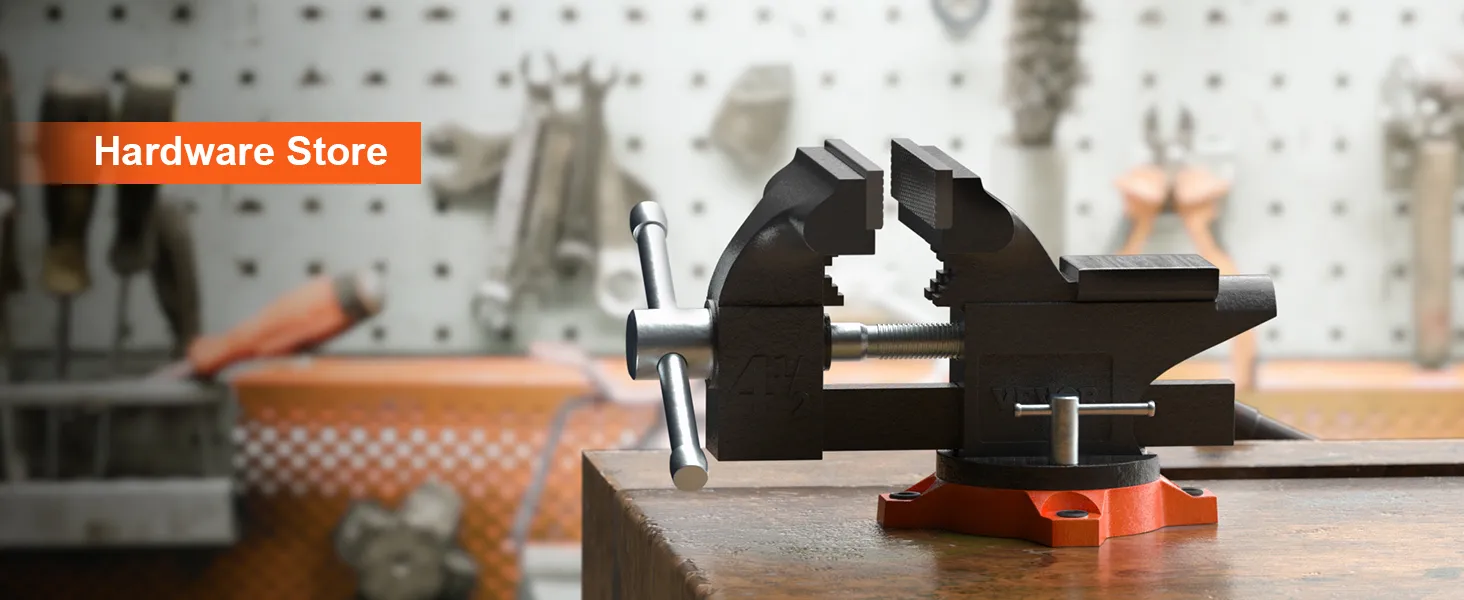 VEVOR bench vise on a workbench in a hardware store with tools on a pegboard background.
