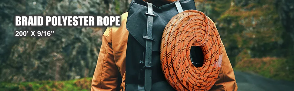 person carrying an orange VEVOR double braid polyester rope in an outdoor setting.