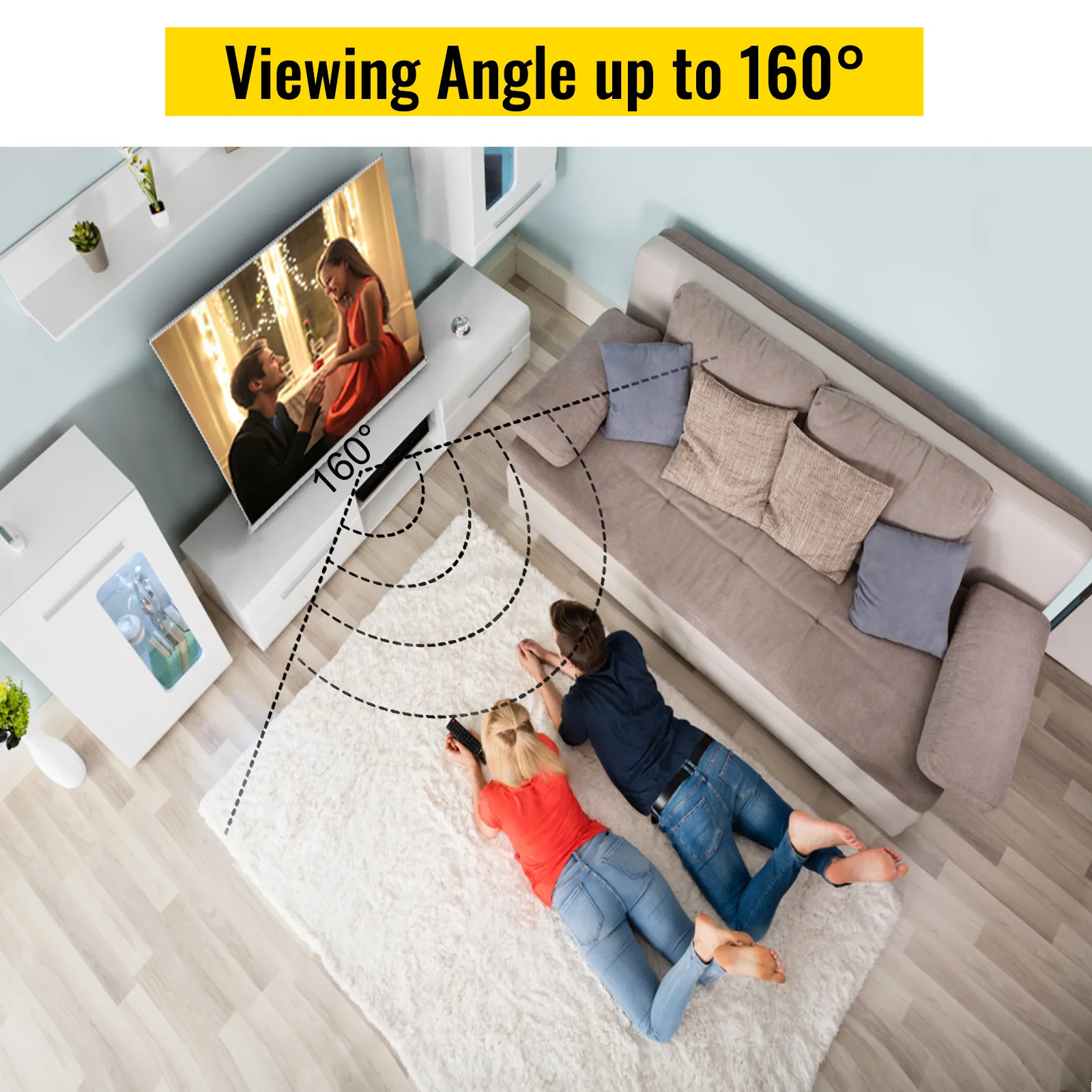 couple watching tv with a 160° viewing angle from a gray l-shaped sofa.
