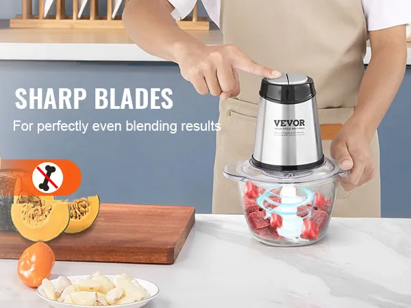 person using VEVOR electric food processor with sharp blades for even blending of red meat on a kitchen counter.