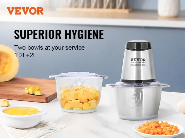 Procesador de alimentos eléctrico VEVOR con dos tazones, verduras recién picadas e ingredientes sobre una encimera.