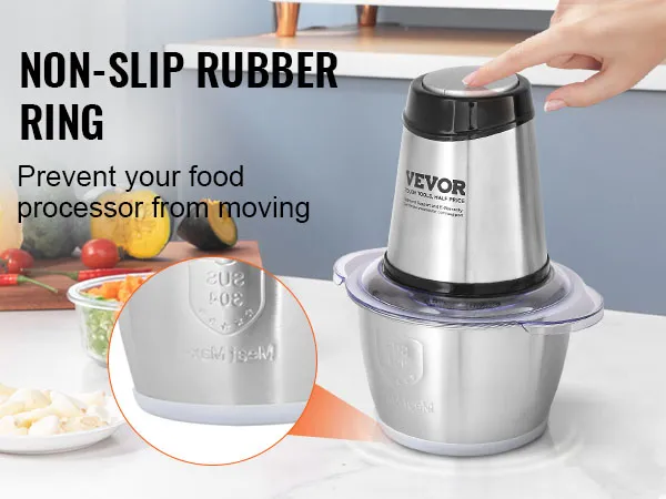 Procesador de alimentos eléctrico VEVOR con anillo de goma antideslizante en la encimera de la cocina con frutas y verduras.