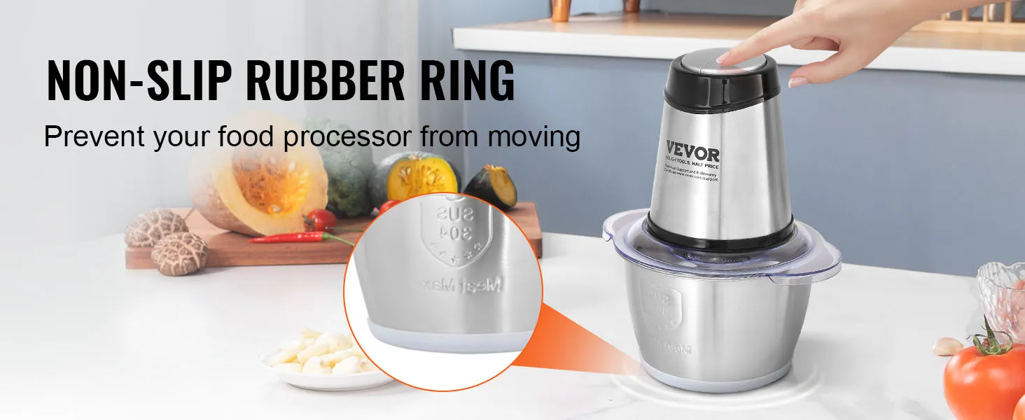 Procesador de alimentos eléctrico VEVOR con anillo de goma antideslizante en la encimera de la cocina con frutas y verduras.