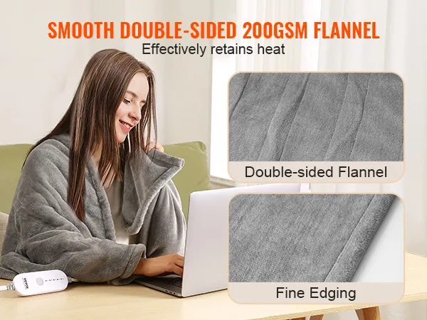 person using VEVOR heated blanket with double-sided 200gsm flannel and fine edging while working on a laptop.