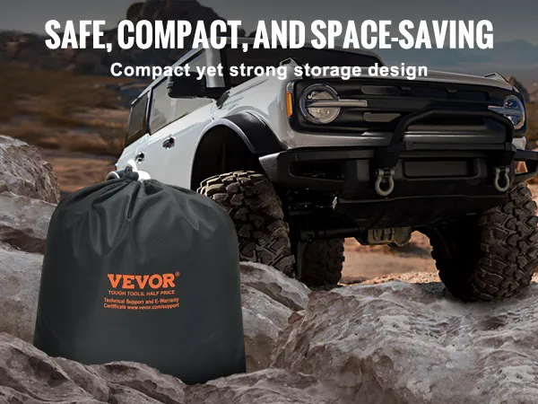 VEVOR tow strap in a bag near a rugged off-road vehicle on rocky terrain, highlighting durability.