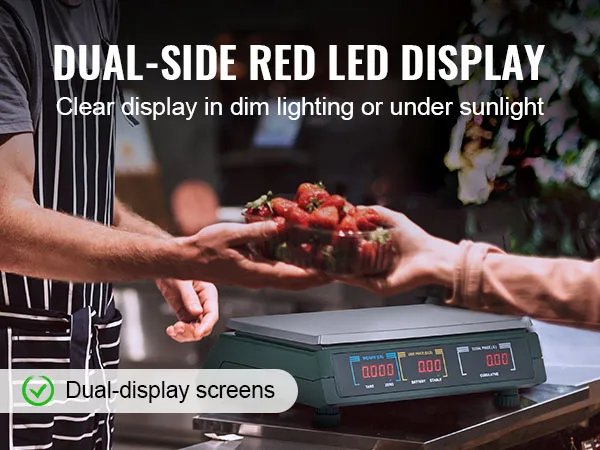 Báscula de cálculo de precios VEVOR con pantalla LED roja de doble cara que pesa fresas en un mercado.