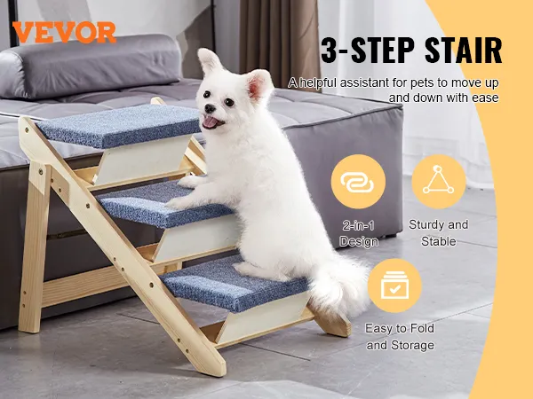 Perro blanco en escaleras para mascotas VEVOR de 3 escalones junto a una cama en una sala de estar moderna, con diseño plegable.