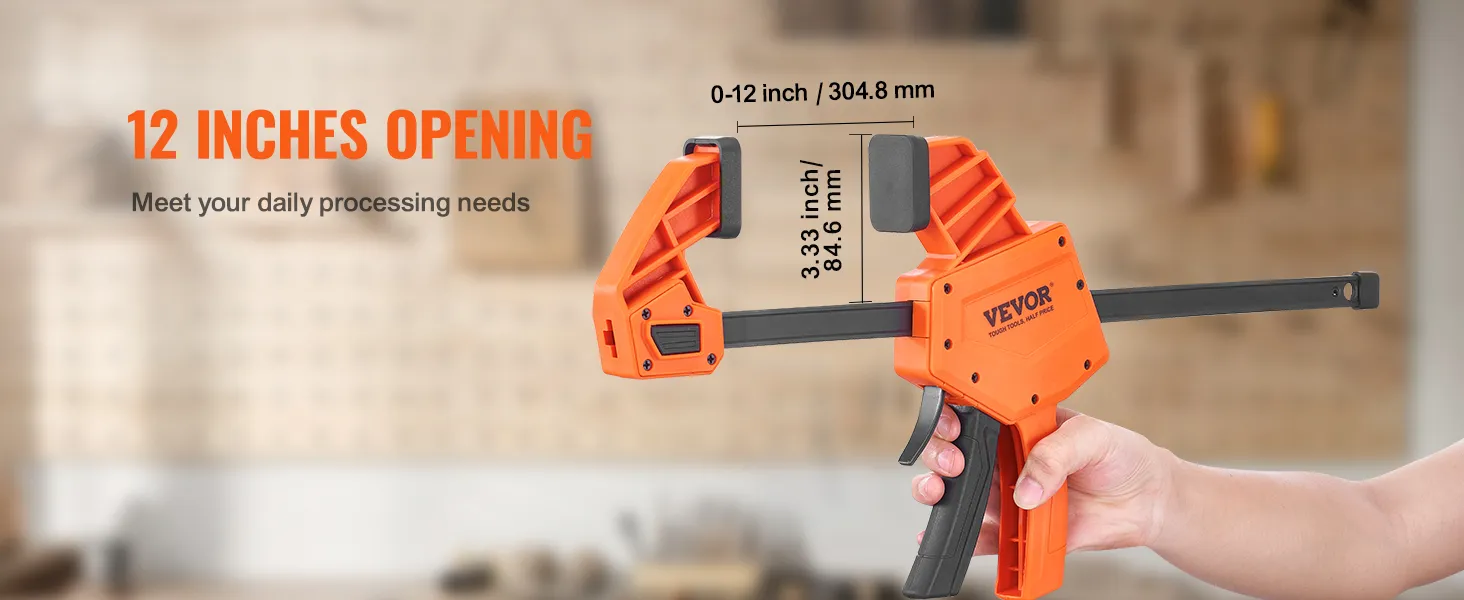 VEVOR bar clamps with 12-inch opening held by a hand in a workshop background.