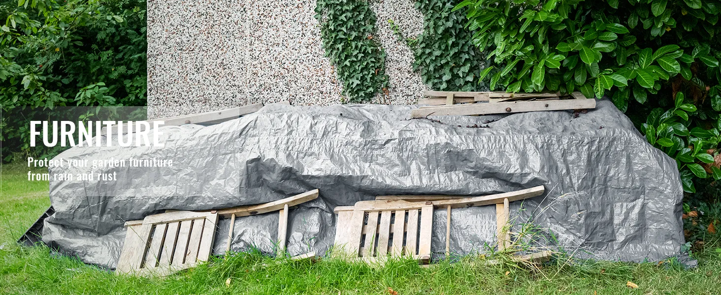 VEVOR waterproof tarp covering garden furniture beside ivy-clad wall and lush greenery.