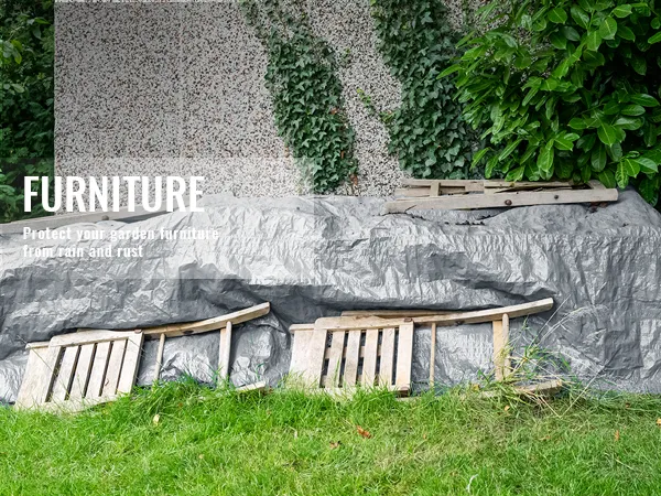VEVOR tarp waterproof protecting garden furniture from rain and rust, surrounded by greenery.