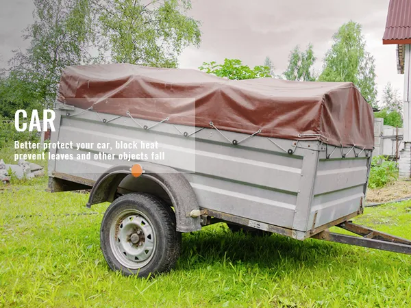 VEVOR waterproof tarp covering a trailer, protecting from elements in a green outdoor setting.