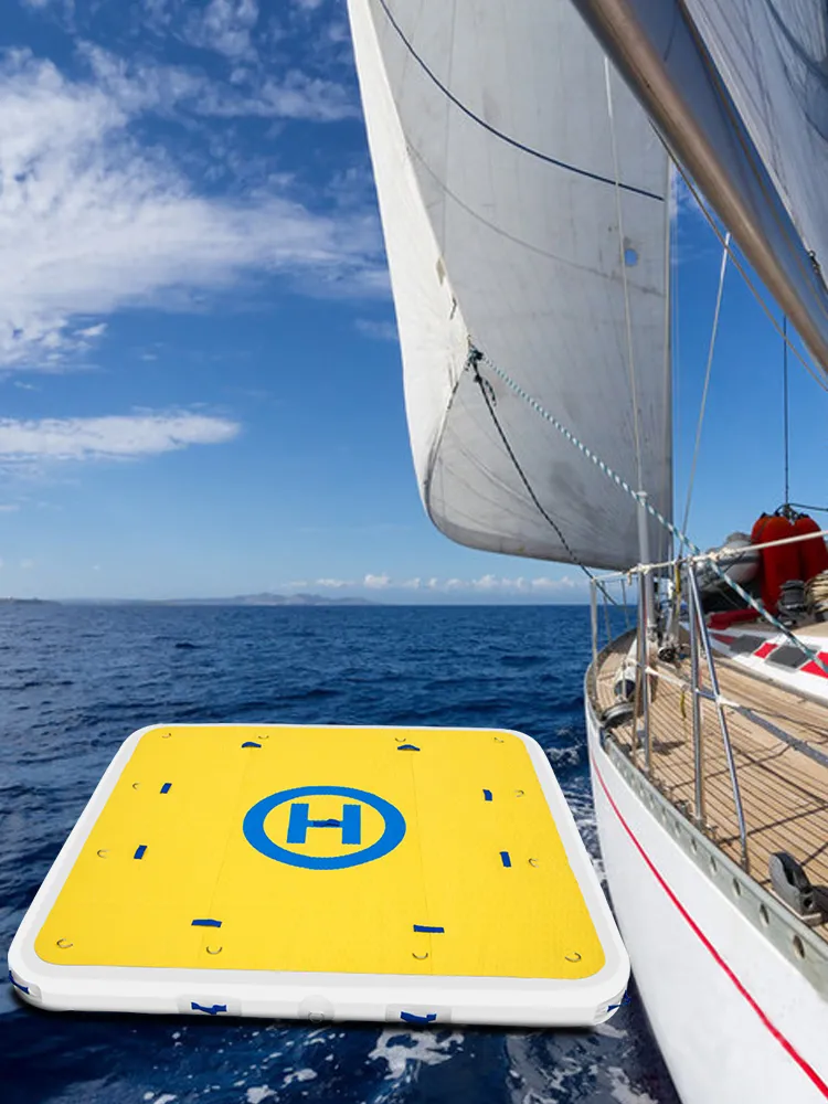 VEVOR inflatable dock platform anchored beside a sailboat on a clear, sunny day.