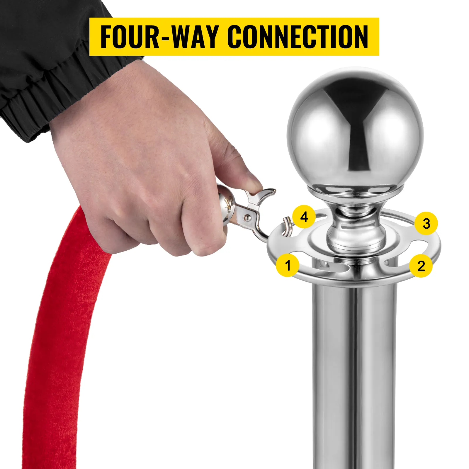 hand attaching a red velvet rope to a shiny VEVOR stanchion post with four-way connection.