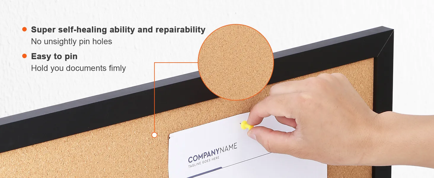 hand pinning a document to a VEVOR cork board with self-healing surface and black frame.