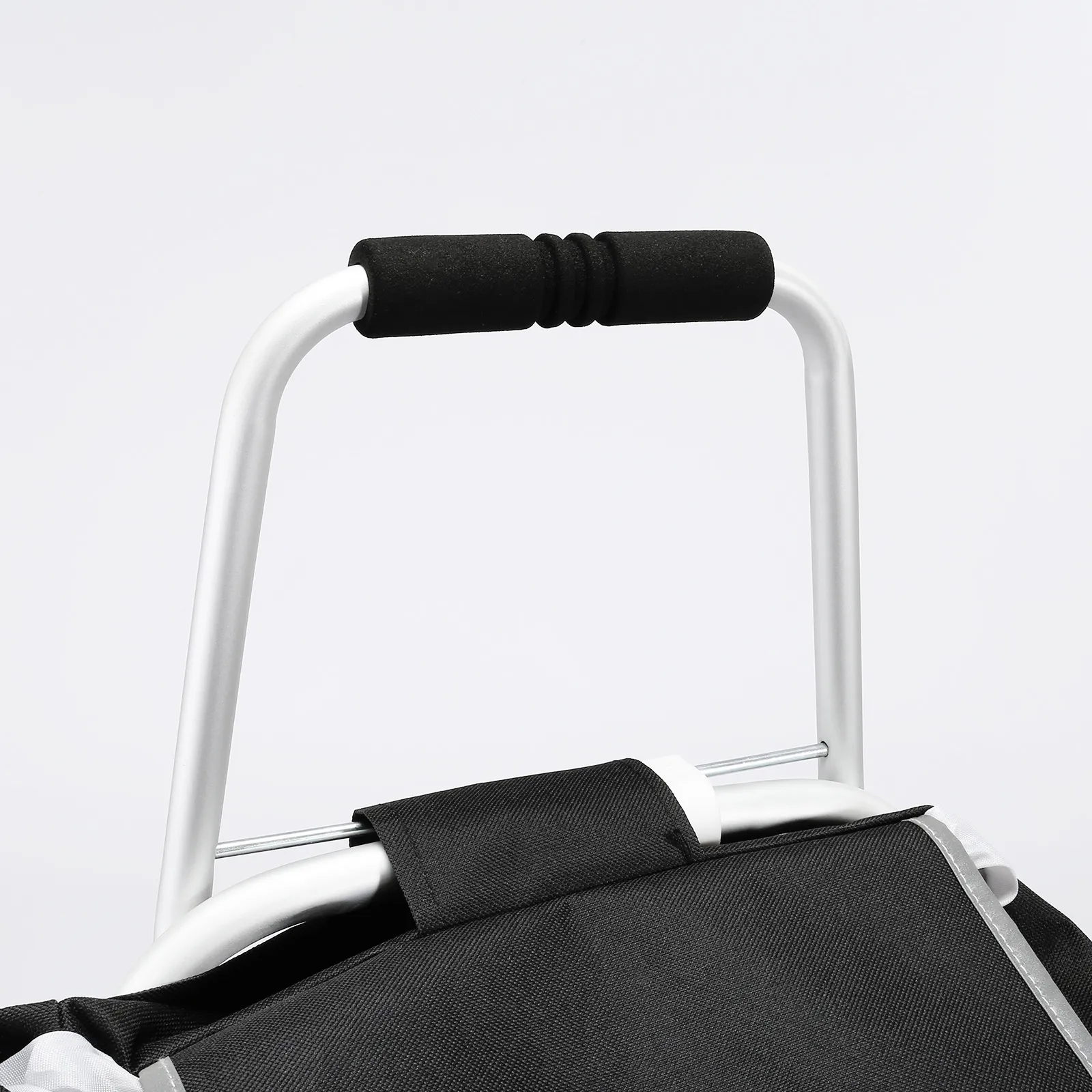 handle and support frame of a VEVOR stair climbing cart with black foam grip and black fabric bag.