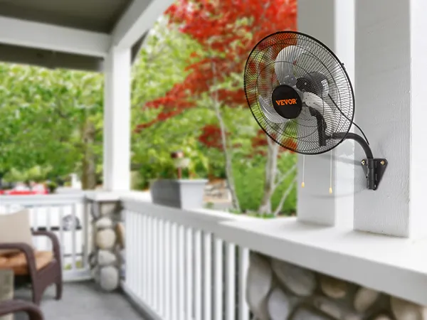 VEVOR wall mount fan installed on a patio, surrounded by green and red foliage, with control features.