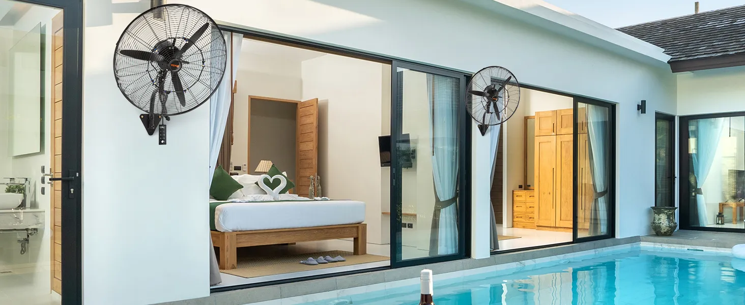 poolside villa with VEVOR wall-mount misting fans installed on the exterior walls.