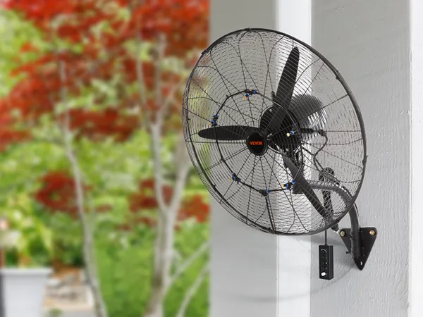 VEVOR wall-mount misting fan installed on a porch column, surrounded by lush greenery.